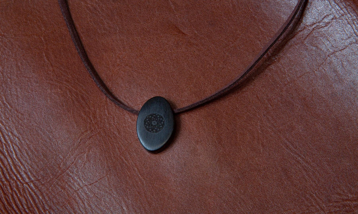 Torus Design in Ebony - ORB Pendant on red