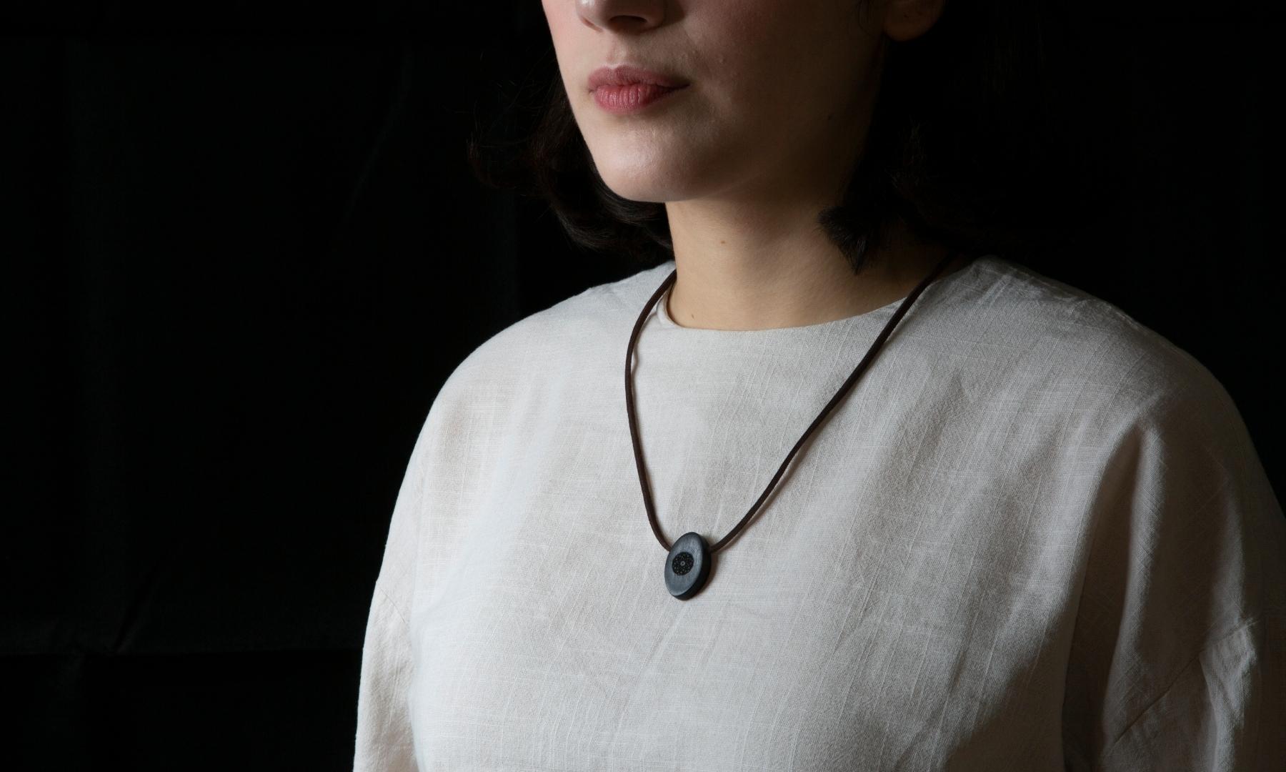 Torus Design in Ebony - ORB Pendant on shirt