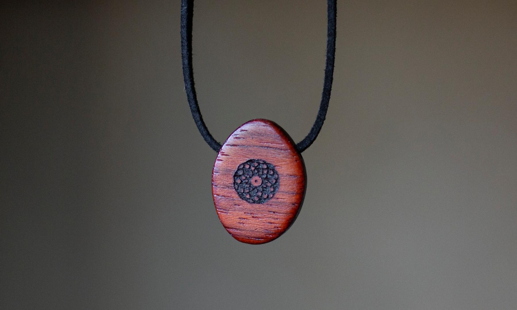 Close up Torus Design ORB Pendant in Padauk